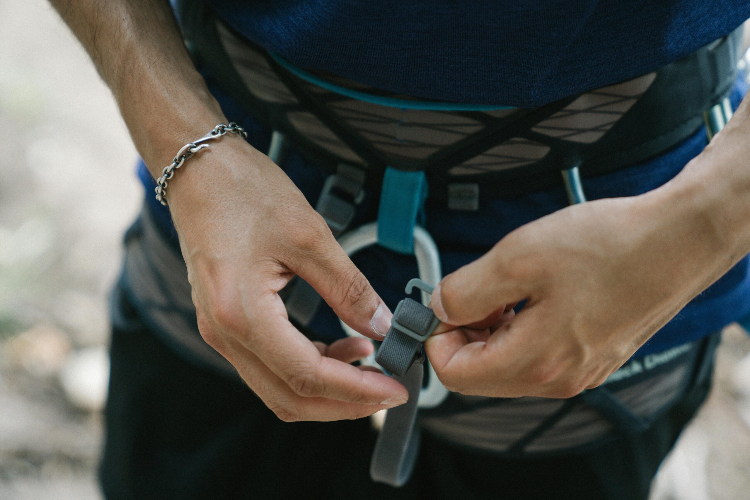 Climber adjusting poorly placed climbing hex