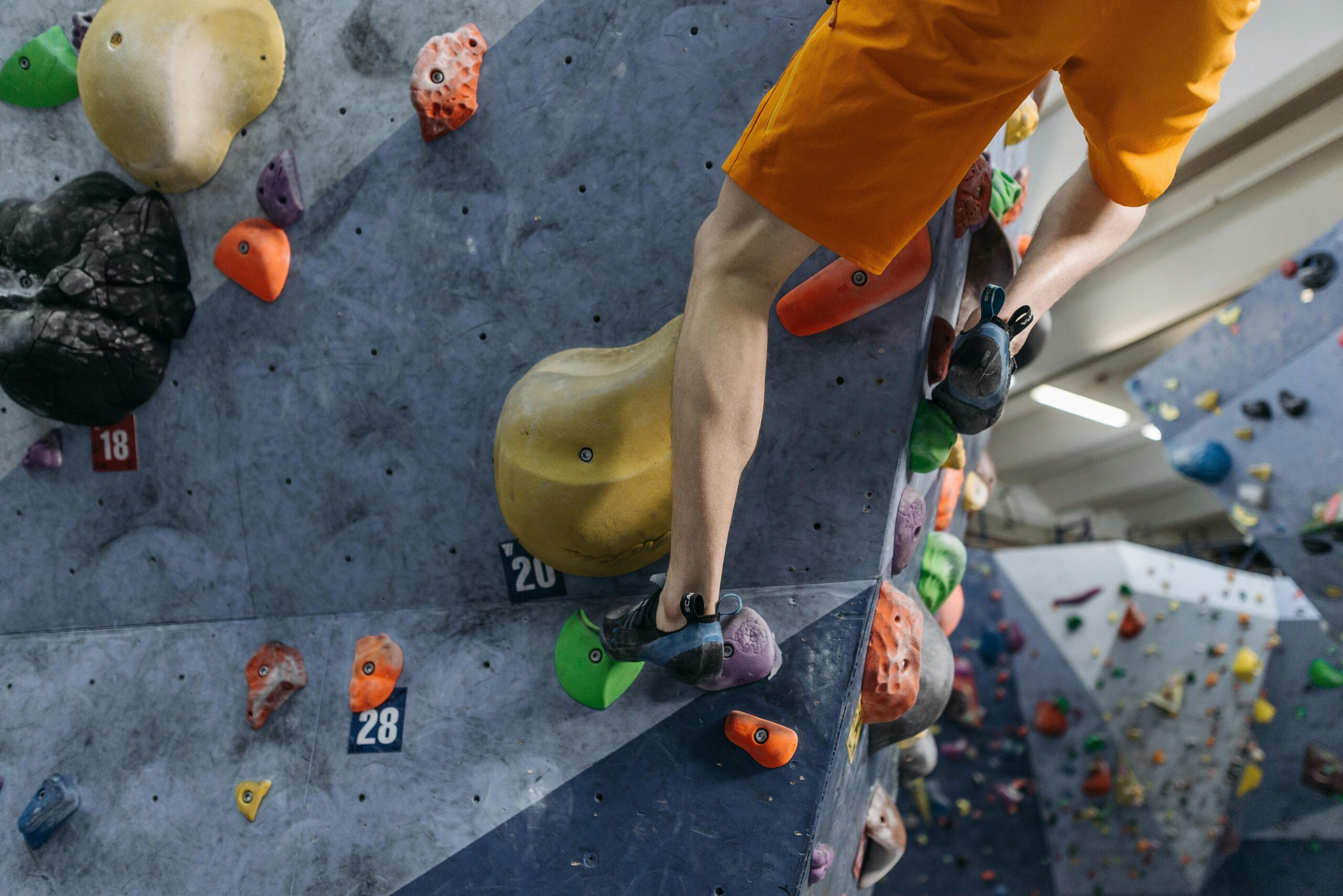 Successful climber showing perfectly placed hexes after completing a challenging route